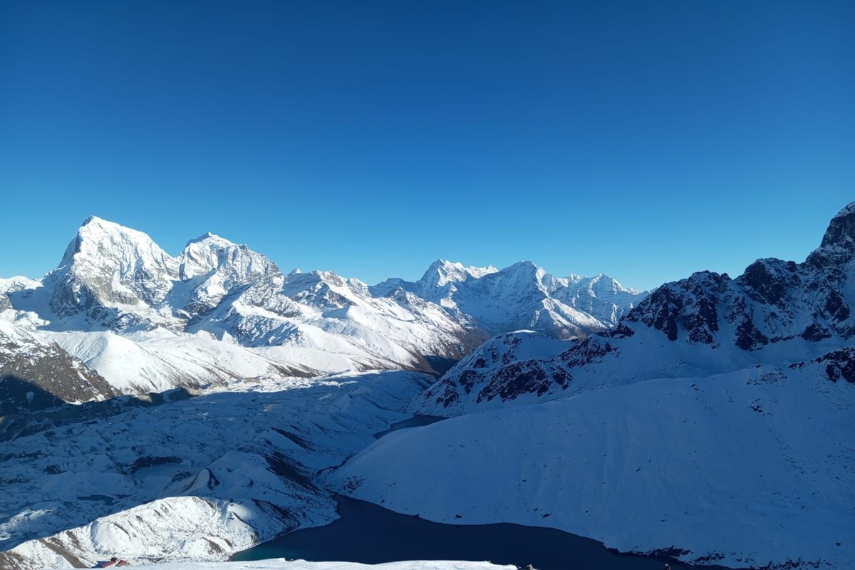 Snow-covered mountain view in January in Nepal Himalayas - winter trekking in Nepal