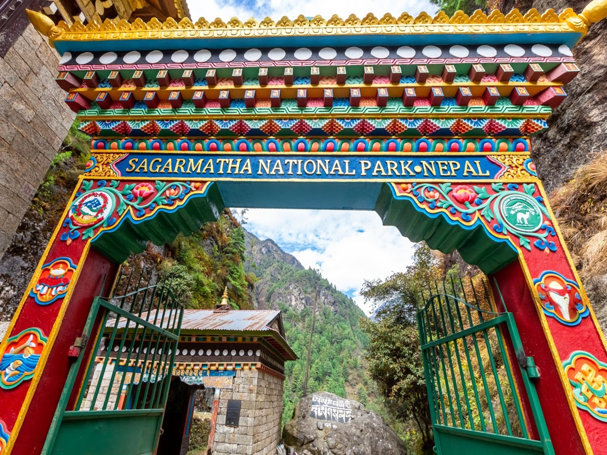 Trekkers entering Sagarmatha National Park through the Monjo entrance gate on the Everest Base Camp trail in Nepal