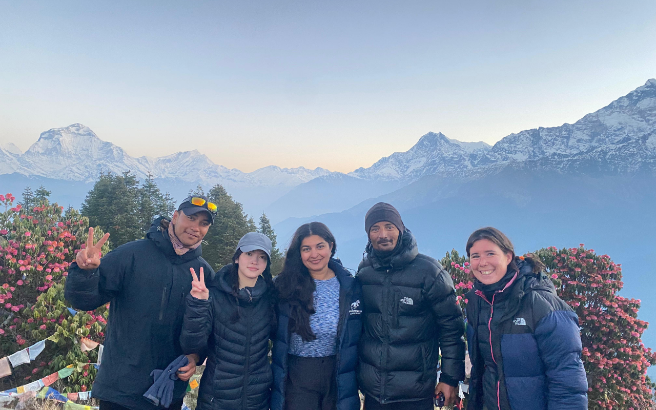Suraj C.K. with international trekkers during a Nepal trekking journey